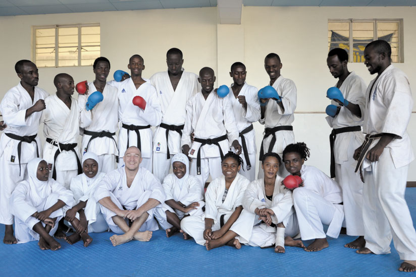 Coach Ruslan Adamov (3rd left front row) in a group photo with the members of Karate National team. (Courtesy)