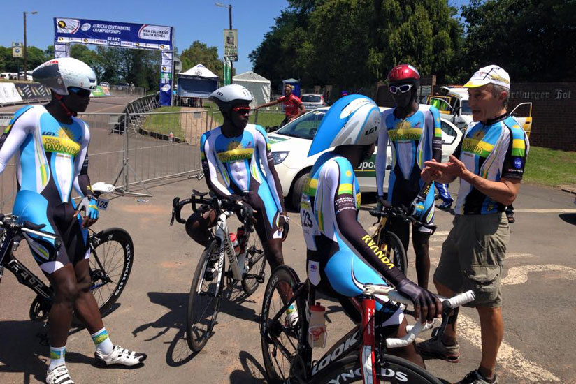 Team Rwanda riders listen to head coach Jonathan Boyer at the continental event in South Africa