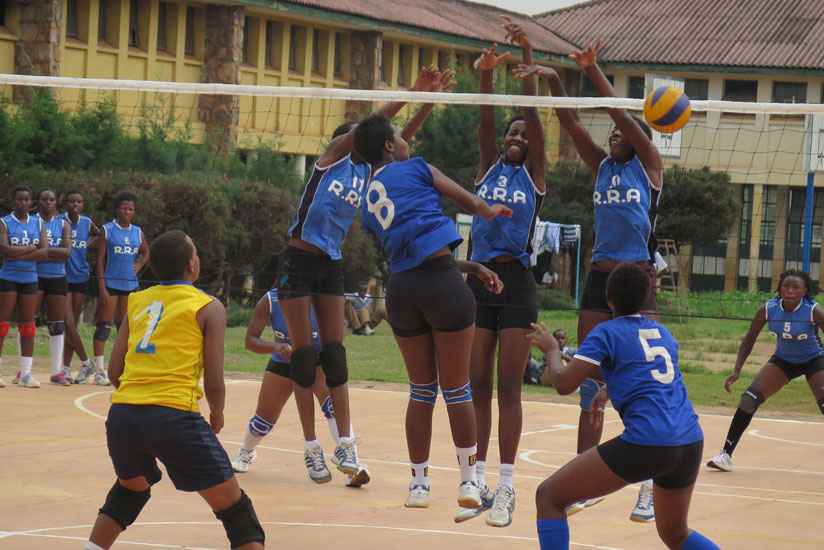 RRA players block the ball from Ruhango Volleybal club players. RRA won the women's title by three sets to nil.  (Emmanuel Ntirenganya)