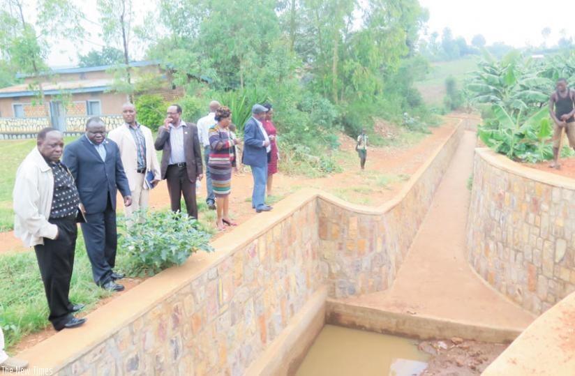 Eala legislators tour a drainage facility in Kayonza District yesterday. (S. Rwembeho)