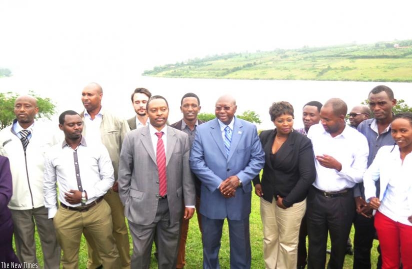Prof. Shyaka (third left) and Manneh (on his left) are joined by civil society members in a group photo on the shores of Lake Muhazi at the end of the seminar. (Stephen Rembeho)