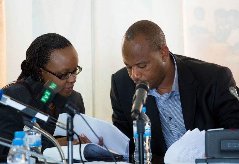 Sharon Haba (L) the permanent secretary at the Ministry of Education goes through the examination sheets with state minister in charge of TVET Albert Nsengiyumva