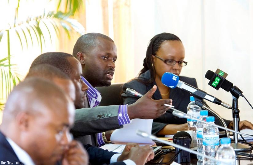 Gasana briefs the media after releasing the 2014 A-Level exam results as the Permanent Secretary in the Ministry of Education Sharon Haba (R), Muvunyi and other officials look on yesterday.(Timothy Kisambira)