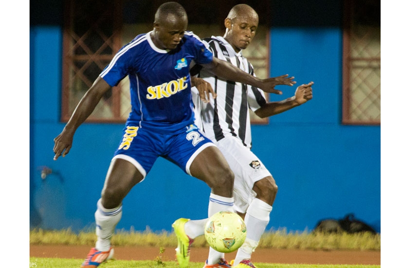 Rayon Sports midfielder Leo Uwanbajemana, left, battles for possesion with former teammate, Djamar Mwiseneza, who joined APR this season. (T. Kisambira)