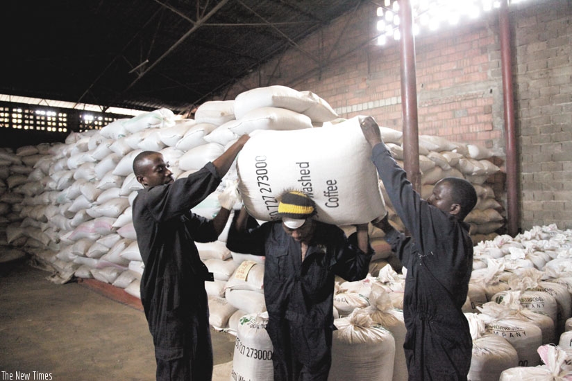 Workers carry coffee bags at Rwanda Trading Company stores. The commodity is one of Rwanda's exports earners. (File)