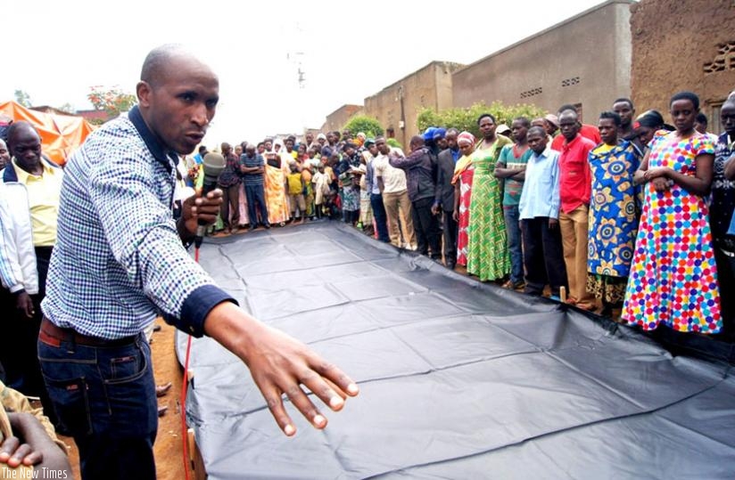 Farmers in Nyagatare admire the Grain-Pro Collapsible Dryer Case last week. (Stephen Rwembeho)