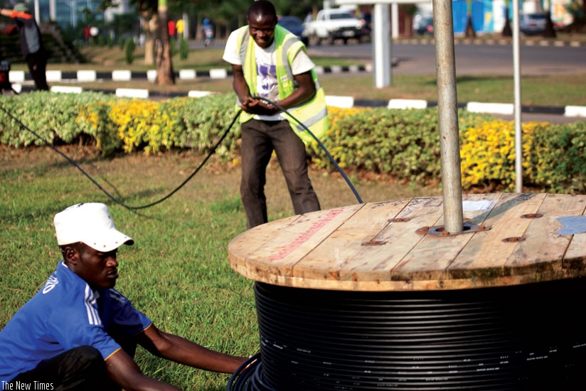 Workers laying fibre optic cables in Kimihurura, Kigali. Internet infrastructure like this is has been a priority for Rwanda to facilitate economic growth. (Timothy Kisambira)