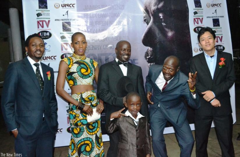 'City of Dust' stars (L-R)- James Bagyenzi, Maureen Jolly Nankya, Carlos Ombonya, Felix Bwanika and Young Kim pose with Ombonya's son. The movie will feature in the festival. (Net)