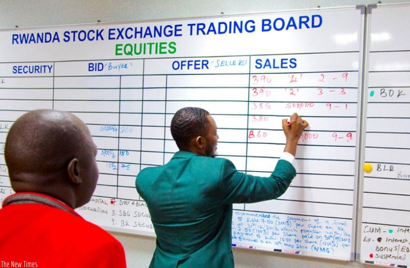A broker conducts bussiness at the stock market. The Rwf15 billion Treasury bond (TB) issued by the central bank on Wednesday has attracted more retail investors compared to that issued in November.(Timothy Kisambira)