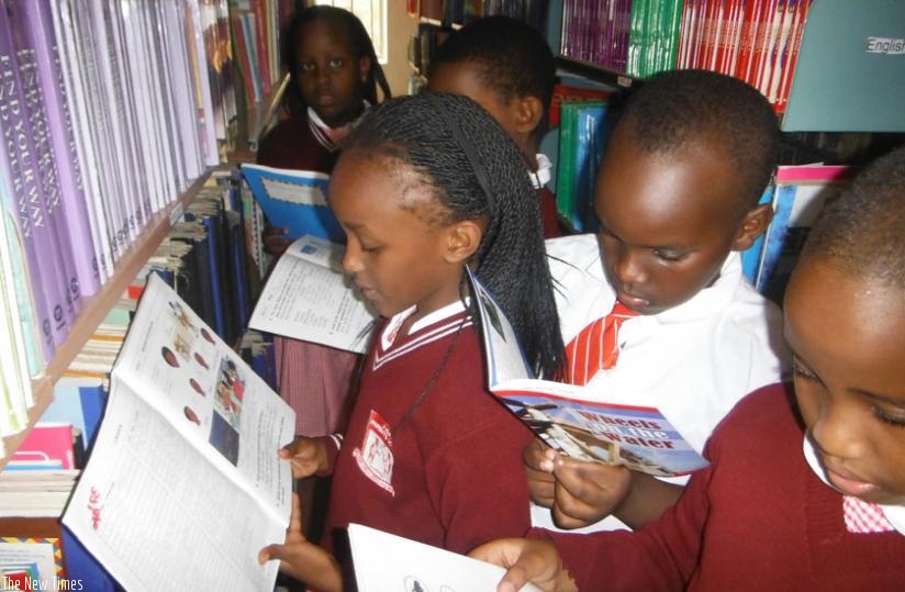 Children reading books in the Library. (Dennis Agaba)