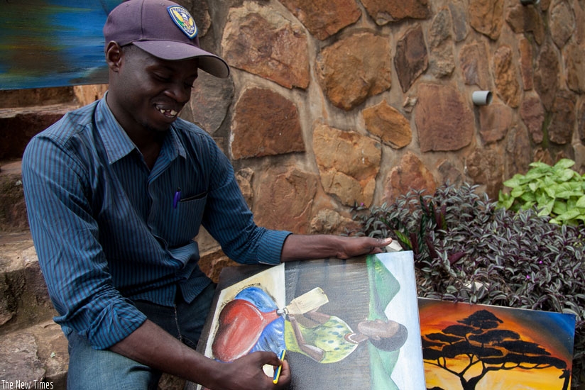 Bagambiki is doing what he enjoys doing most - painting. (Mary Ingabire)