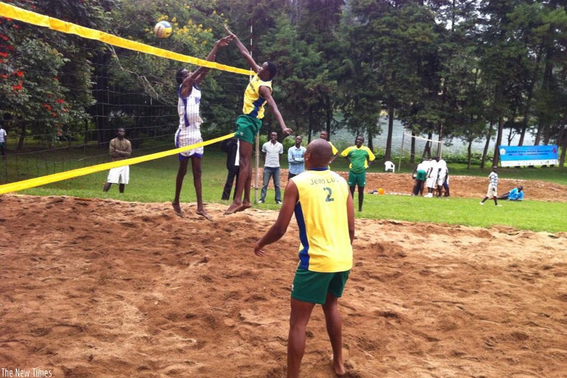 Flavien Ndamukunda (right) hits the ball past an opponent in a local competition in Rubavu. (File)