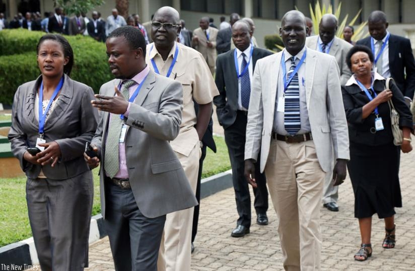 Delegates leave the meeting room during a break yesterday at the Rwanda Revenue Authority offices. The summit has attracted senior officials from EAC member states . (John Mbanda)