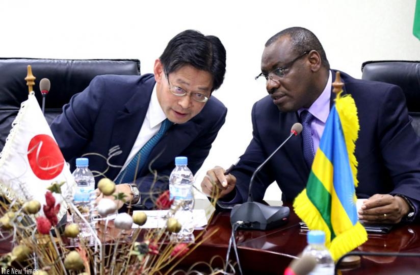 Finance minister Claver Gatete (R) chats with Ogawa at the signing ceremony in Kigali yesterday. (John Mbanda)