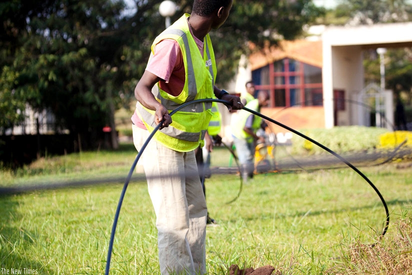 Workers install fibre optic cables in Kimihurura, Kigali. (File)
