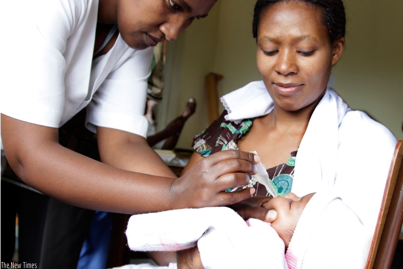 A nurse immunises a baby at Police Hospital in Kacyiru. (Timothy Kisambira)