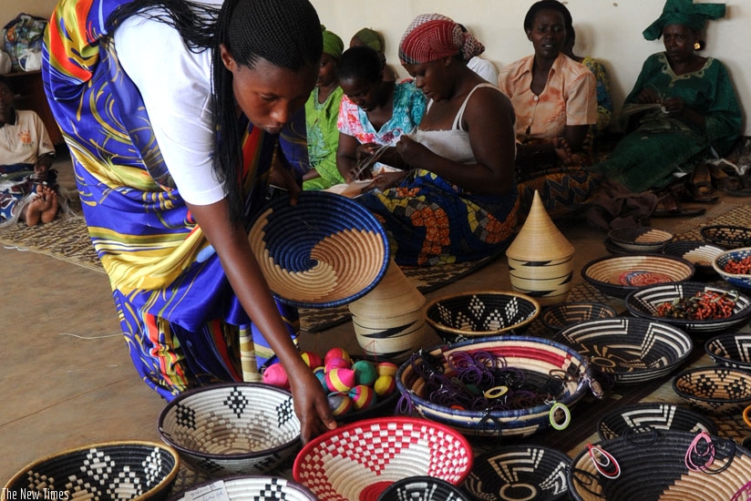 Women weaving baskets to support their families. (John Mbanda)