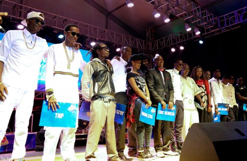 All the ten finalists pose with the judges. (John Mbanda)