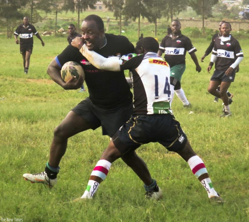 Jean de Dieu Habimana tries to stop Lion de Fer captain Olivier Nikwigize. (Stephen Kalimba)