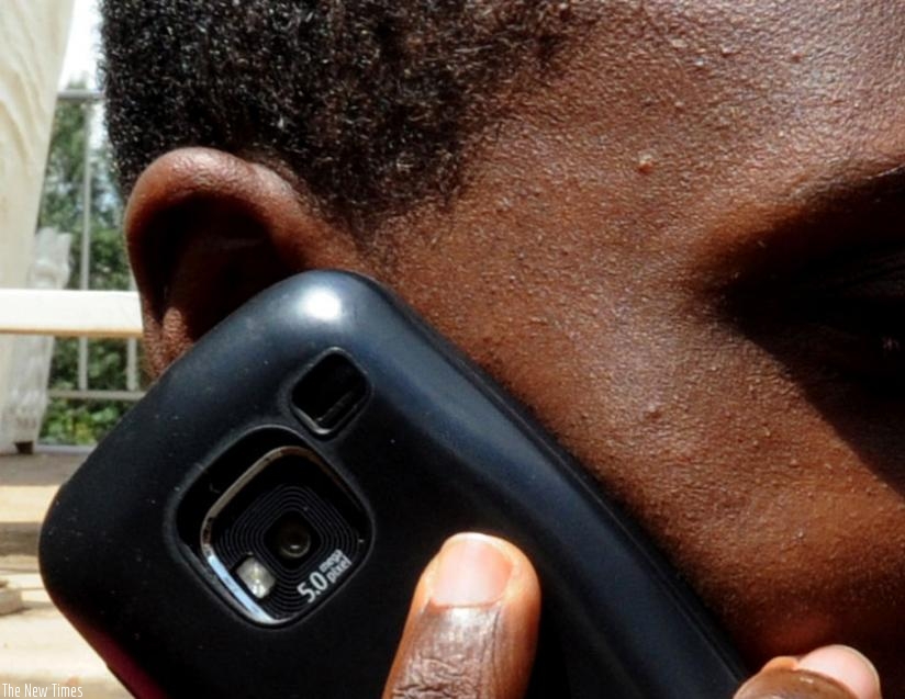 A man speaks on phone. The one area network has positively impacted on doing business. (File)