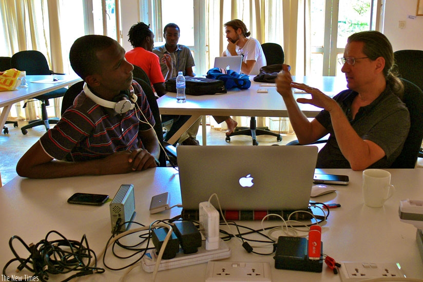 Drew Weatherstone talks to The New Times' Faustin Niyigena at the workshop. Photos by Tali Lieber.