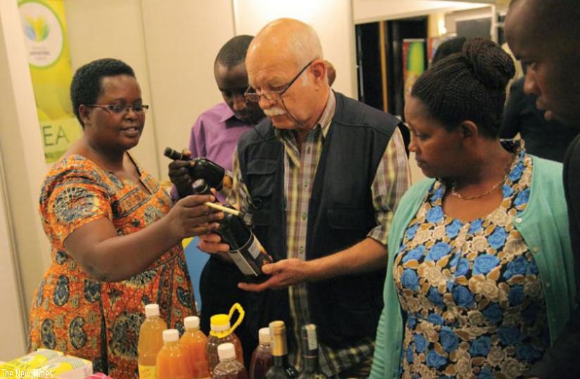 An axhibitor explains how she makes wine at Serena Hotel last year. (File)