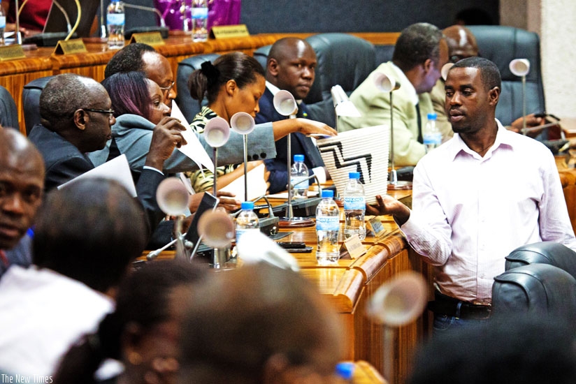 An electoral agent collects votes at Parliament yesterday. (John Mbanda)