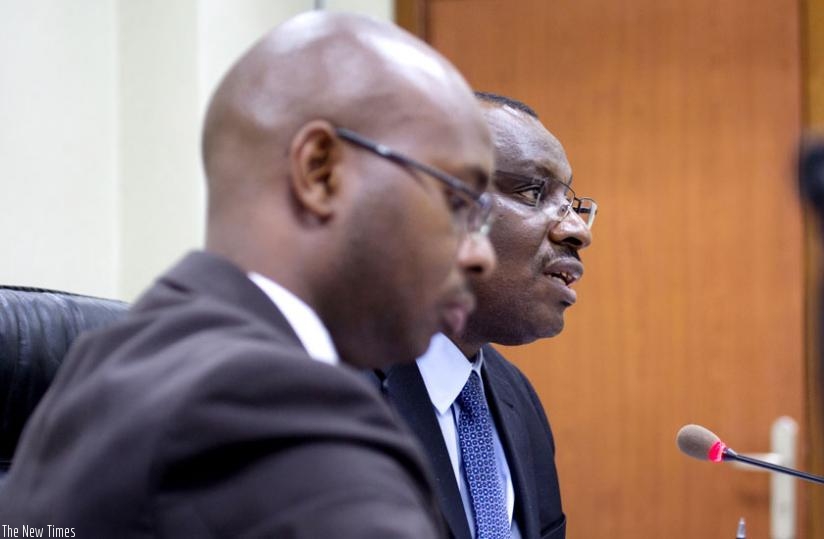 Minister Gatete addresses the media as Murangwa checks his notes in Kigali yesterday. (Timothy Kisambira)