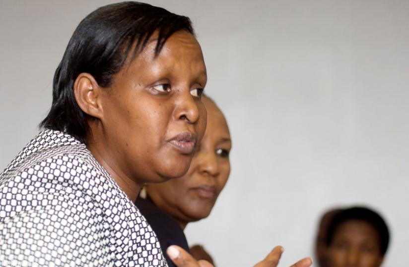 Gender and Family Promotion minister Oda Gasinzigwa speaks to members of the parliamentary Standing Committee on Unity, Human Rights and fight against Genocide as Zaina Nyiramatama, the executive secretary of the National Commission for Children, looks on yesterday. (Timothy Kisambira)