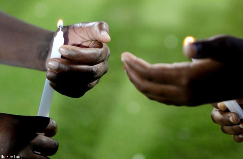 Children light candles at Amahoro Stadium during Kwibuka20 commemoration event last year. (File)