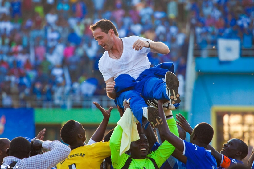 Rayon Sports players and fans lift Gomes after he guided the club to the 2013 league title. (File)
