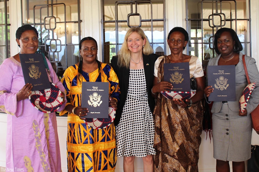 Amb. Barks-Ruggles poses for a picture with the award winners at her residence in Kigali on Thursday. (Courtesy)