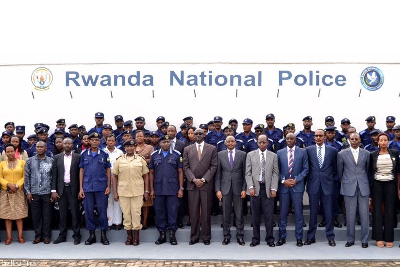 Busingye (centre) and IGP Gasana (to his right) pose for a picture with participants in Kigali yesterday. (Courtesy)