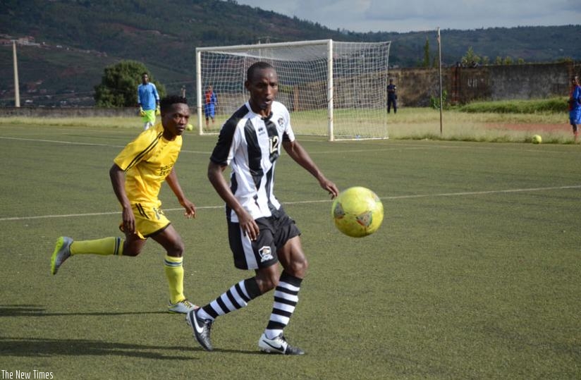 APR winger Jean Claude Iranzi controls the ball as a Mukura defender approaches on Sunday. (Sam Ngendahimana)