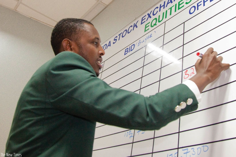 An RSE staff records deals during a recent trading session on the bourse.  