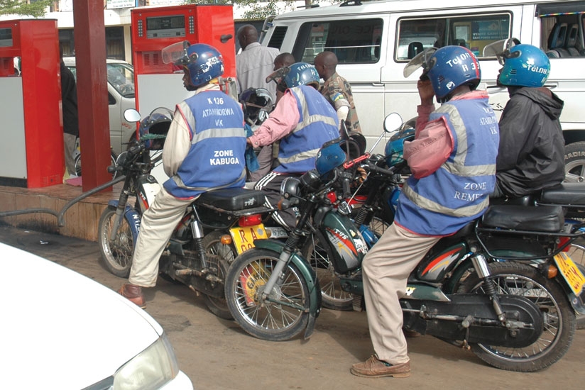 Moto-taxi operators wait to refill at a city fuel station. There is increasing demand for oil and petroleum products. (File)