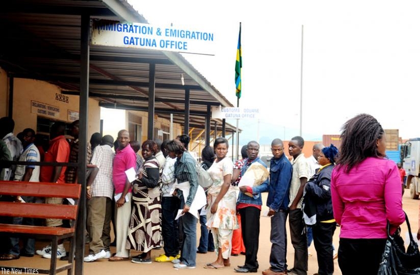 Travellers clear their documents at Gatuna border post with Uganda before crossing out of the country. (File)