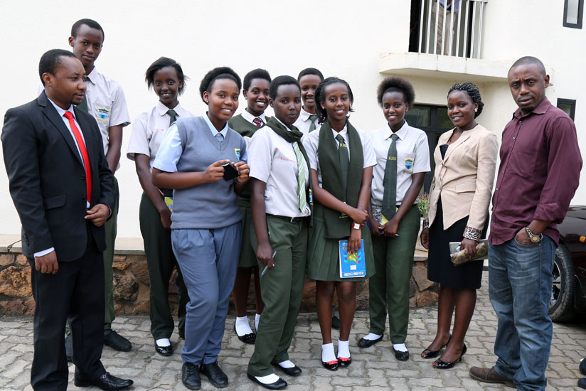 Students of Riviera High School pose for a photo with their teachers Saturday January (left) and Jane Nakaayi (second right) at The New Times last week. (All photos by Solomon Asaba)