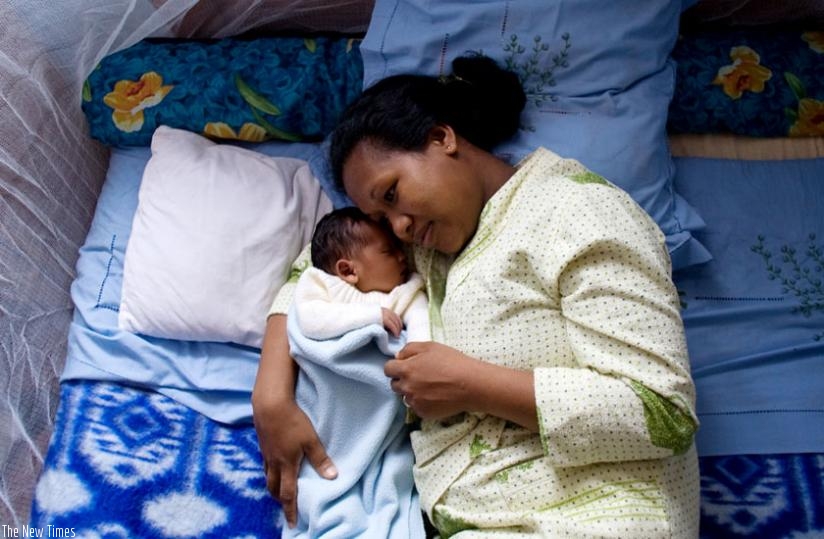 A mother with her baby at a health centre. The Maternity Benefits Leave scheme will help eliminate the worry of working mothers who have to fend for their families. (File)