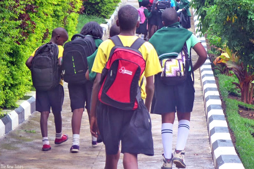 Pupils leaving school for home. Day schools enable them to interact with their parents on a daily basis. (Solomon Asaba)