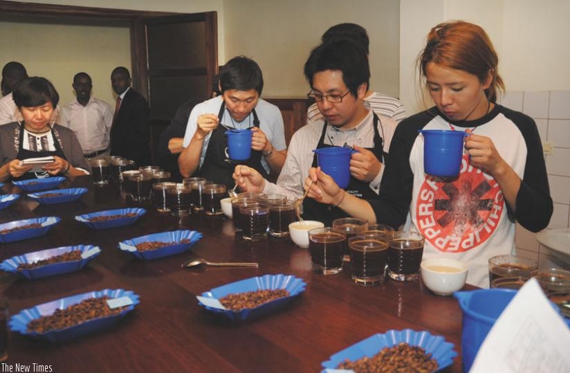 International coffee cuppers taste Rwandan coffee at Naeb offices in Kigali in 2013. (John Mbanda)