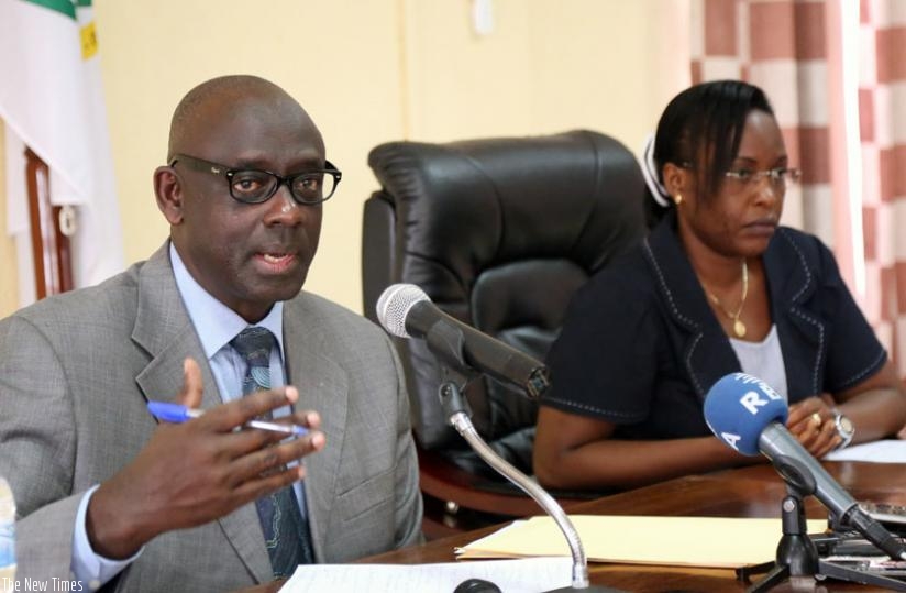 Justice minister Johnson Busigye (L) addresses to the media as Justice Ministry permanent secretary Isabelle Karihangabo looks on after the swearing of bailiffs in Kigali, yesterday. (John Mbanda)