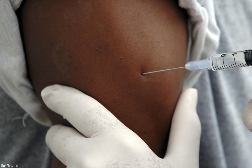 A woman gets a vaccine against Hepatitis B.