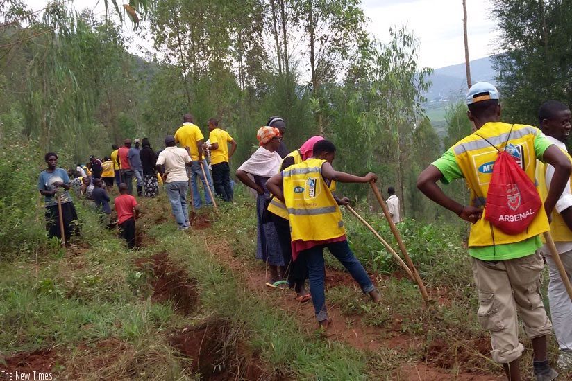 MTN staff and agents during Umuganda on Saturday. The telecom firm supports community initiatives. (Courtesy)