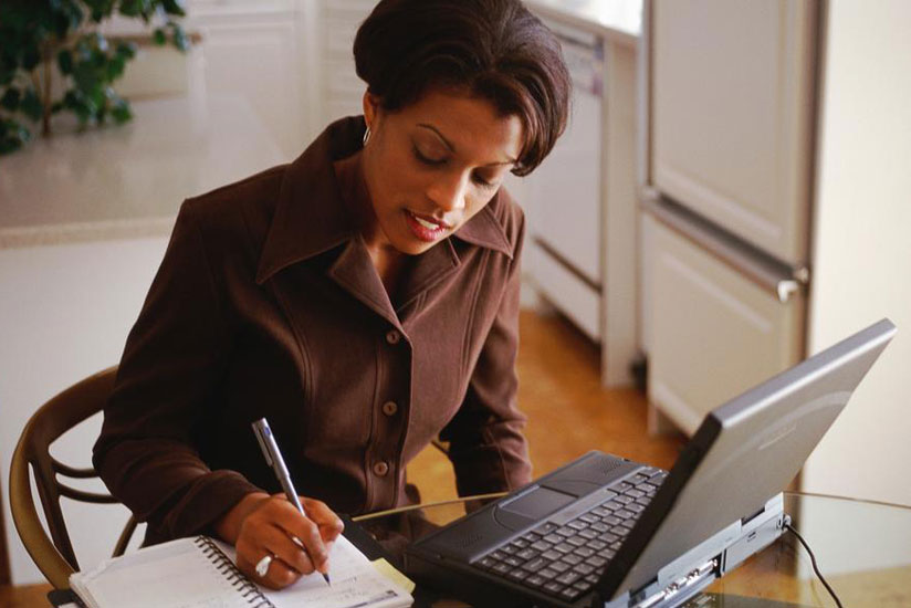 A businesswoman takes notes. Businesses should always conduct periodic audits to ensure that all is going on well. (File)