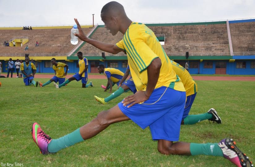 Amavubi players strech during their last training session on friday. The wasps lost to Zambia in a friendly yesterday. (Sam Ngendahimana)