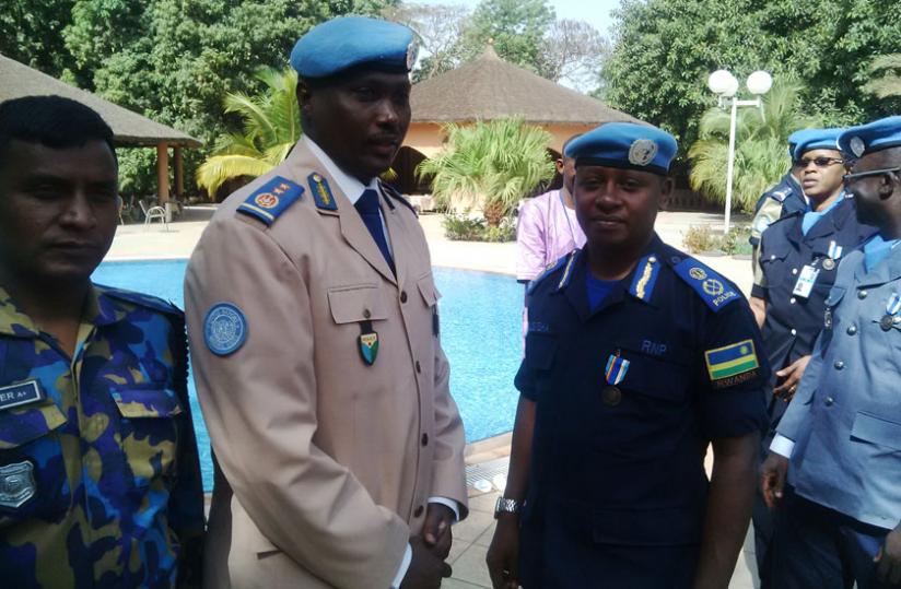CP Joseph Mugisha (2nd right) after being awarded a medal for his exceptional leadership in Mali. (Courtesy)