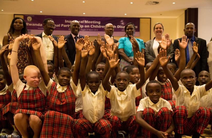 Children with visual impairment from Kibeho Institute of the Blind, Nyaruguru District, pose for a photo with guests at Hotel Serena last week. (Timothy Kisambira)