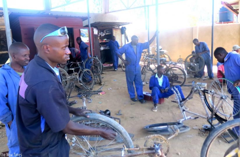 Youths repair bicycles at their Agakiriro centre in Bugesera. (Stephen Rwembeho)