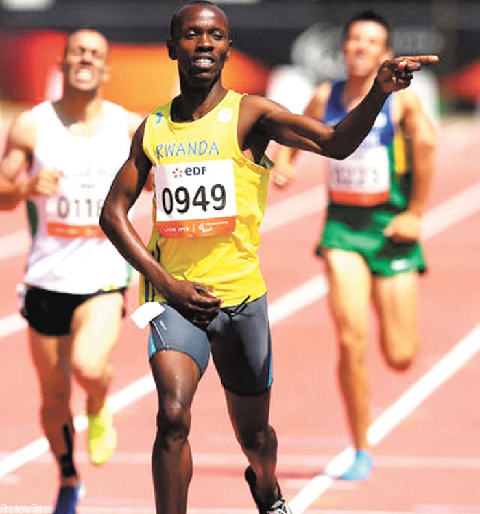 Hermas Muvunyi celebrates after grabbing Gold at the 6th IPC World championships in Lyon,France in 2013. (Courtesy)